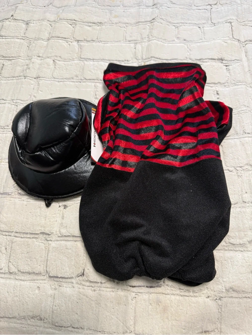 Pet warrior Dog striped red and black shirt and black pants. Halloween custome.